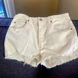 Great white Levi’s cut offs shorts.